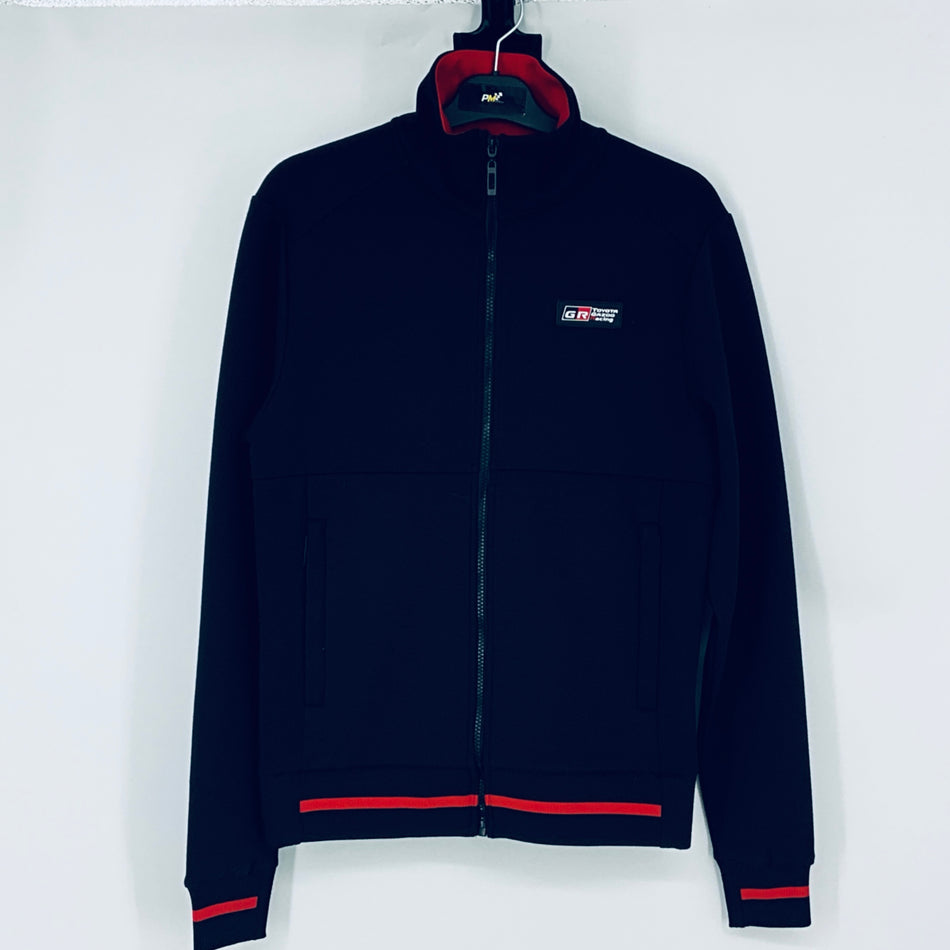 Dark navy full-zip sweatshirt, red-lined hood, chest logo, red cuff and hem stripes