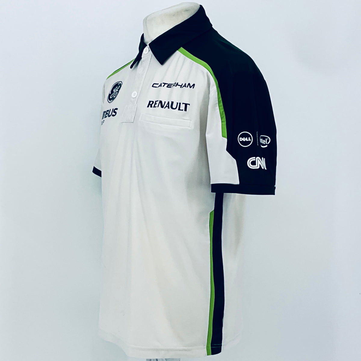 Team polo shirt side/back view: white body with navy sleeve and green vertical panel