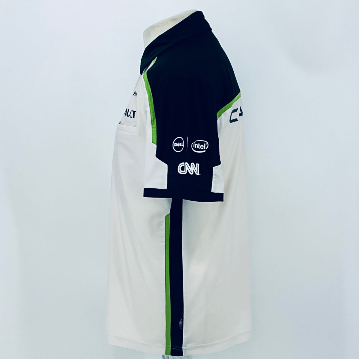 Team polo shirt back/side view: navy sleeve, white panels, and green piping
