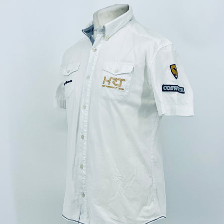 White pit crew button-up shirt with short sleeves and side chest logo patch detail.