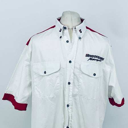 White button-up shirt with maroon shoulder stripes, chest pockets, and Bridgestone Motorsport logo.
