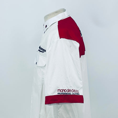 White shirt with maroon shoulder panel and maroon hem band, short sleeves with logo.