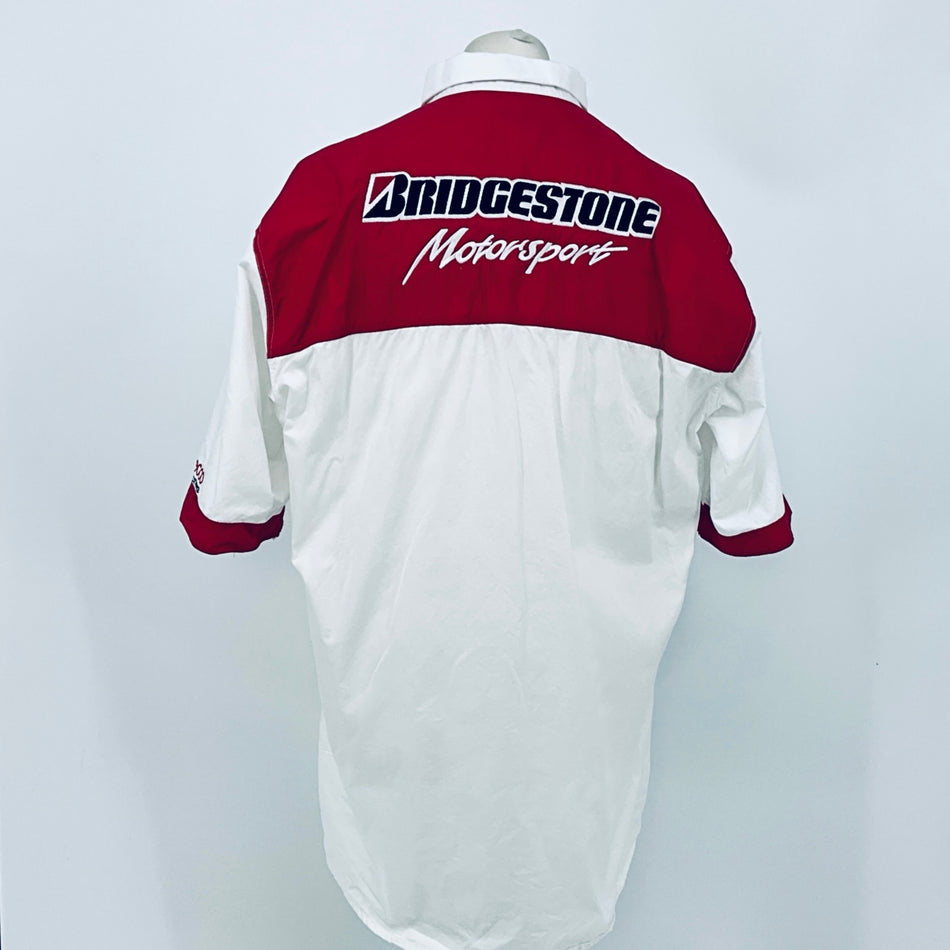 Back view: white shirt with maroon upper back featuring Bridgestone Motorsport logo.