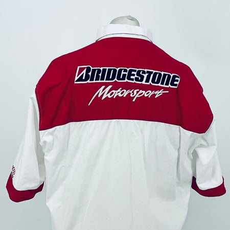 Maroon back yoke with large Bridgestone Motorsport logo; white shirt with maroon cuffs.
