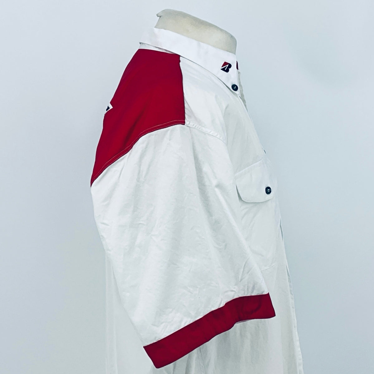 White button-up shirt with maroon shoulder and sleeve trim, chest pocket, short sleeve.