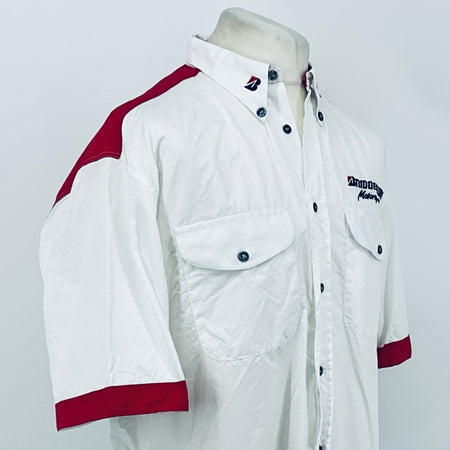 White button-up with maroon shoulder stripe, chest pocket flaps, and Bridgestone Motorsport logo.
