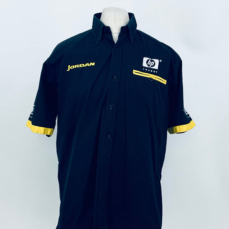 Dark blue button-up team shirt with yellow armband trim, JORDAN and hp invent logos