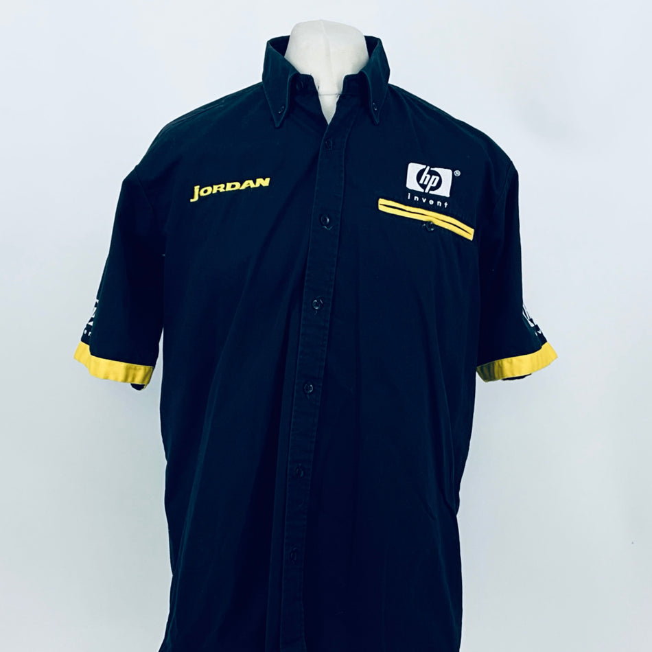 Dark blue button-up team shirt with yellow armband trim, JORDAN and hp invent logos