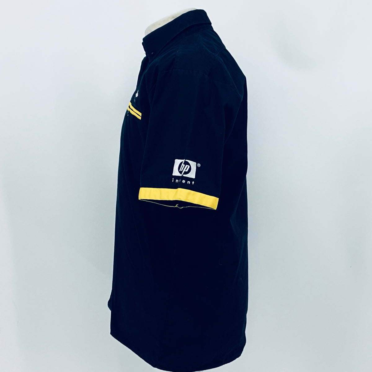 Dark blue team shirt side view with yellow sleeve stripe and hp invent logo