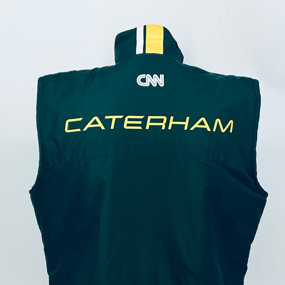 Dark teal team gilet with hood, full zip, CATERHAM text and CNN logo on back