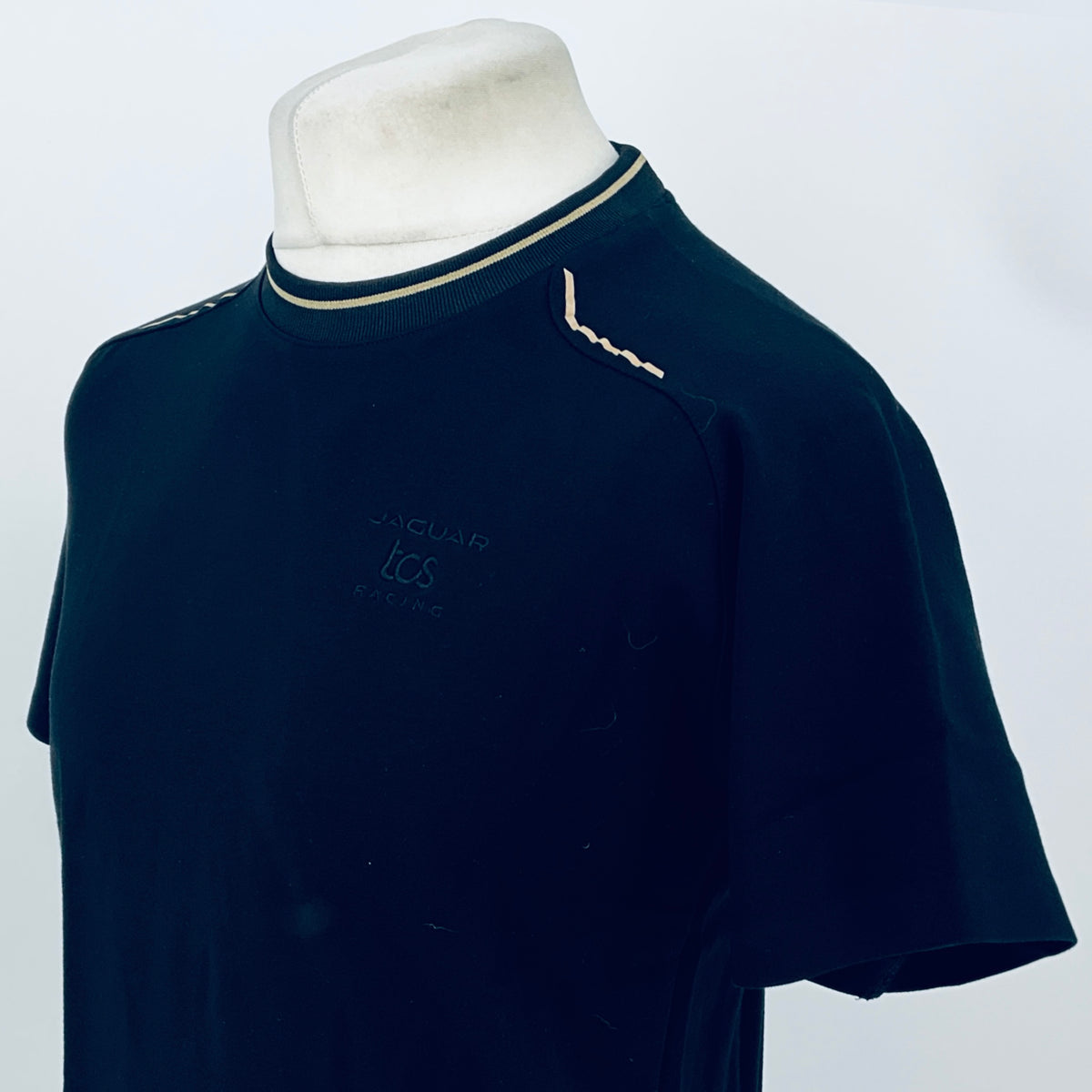 Dark navy crew-neck T-shirt with contrast collar trim and left chest Puma-style logo