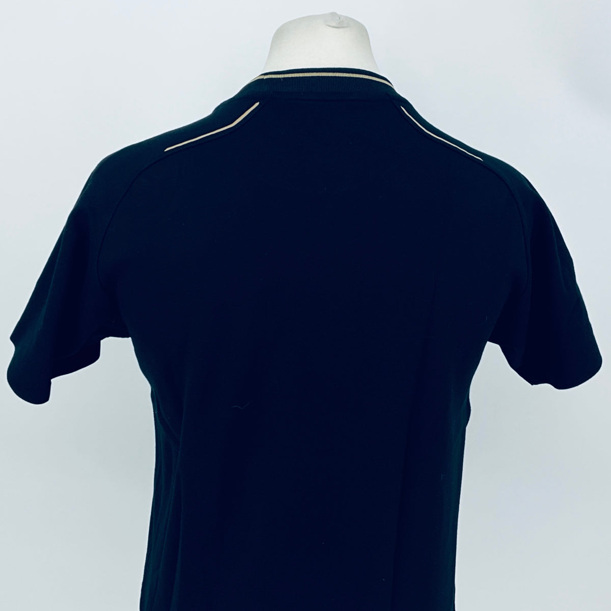 Dark navy crew-neck team T-shirt with contrast collar trim, back view