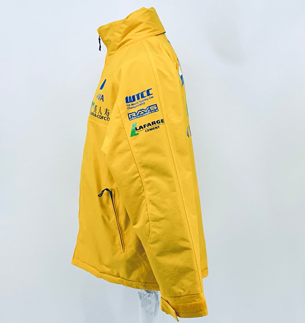 Yellow racing jacket quarter view with ITC and RAYS sponsor patches and hood detail.
