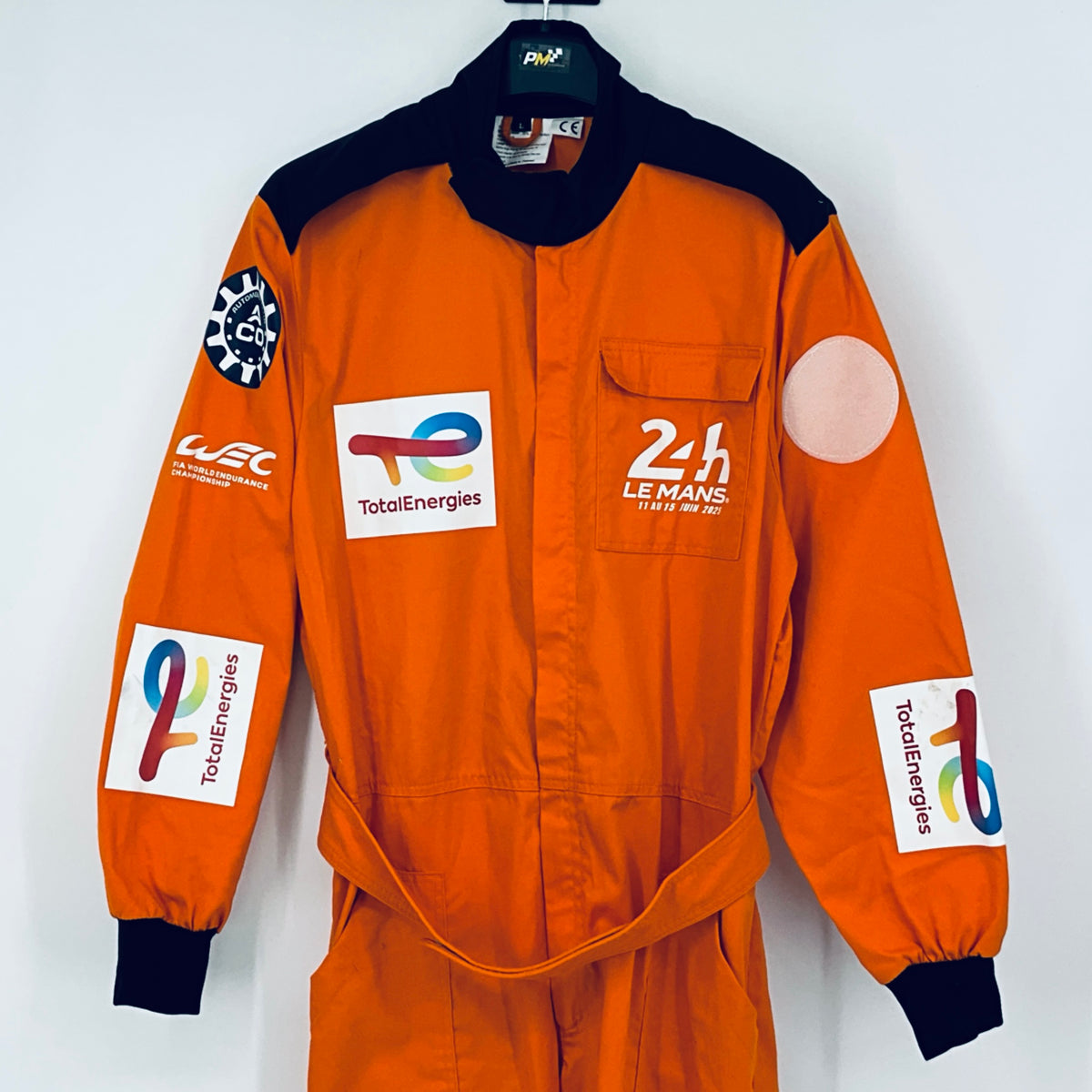 Orange racing marshals overalls with navy collar, 24h Le Mans and TotalEnergies logos