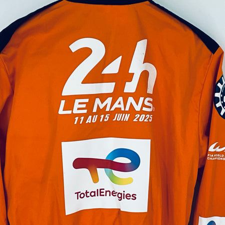 Orange overalls back close-up showing 24h Le Mans and TotalEnergies logos
