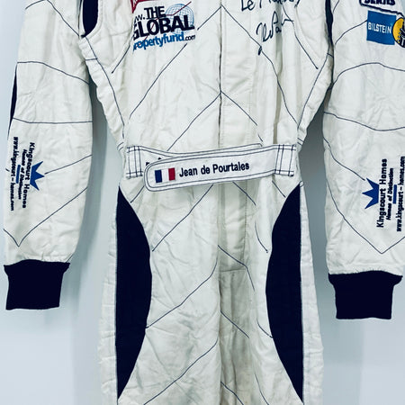 Race-worn driver suit front view: name tab at waist and navy side stripe panels.