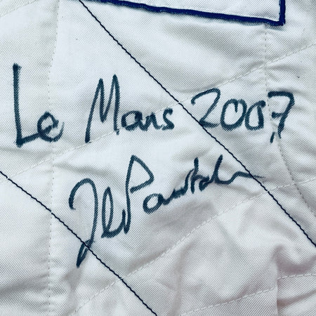 White suit panel with handwritten signature, 'Le Mans' and '2007'