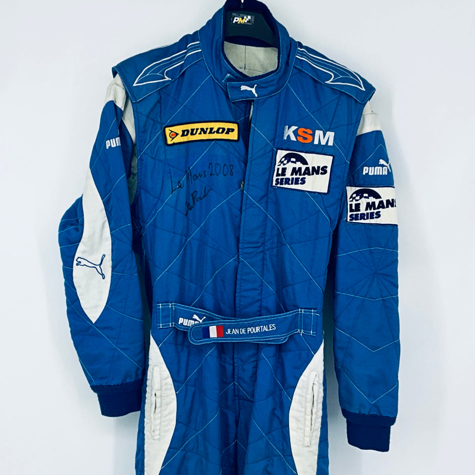 Blue race-worn driver suit with front zipper, sponsor patches, and white side panels