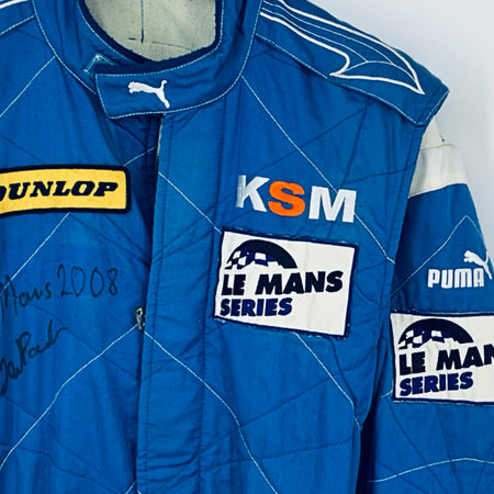Blue driver suit chest with KSM patch, Le Mans Series logo, and PUMA branding
