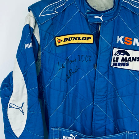 Blue driver suit front with DUNLOP patch, KSM and Le Mans Series logos, autograph
