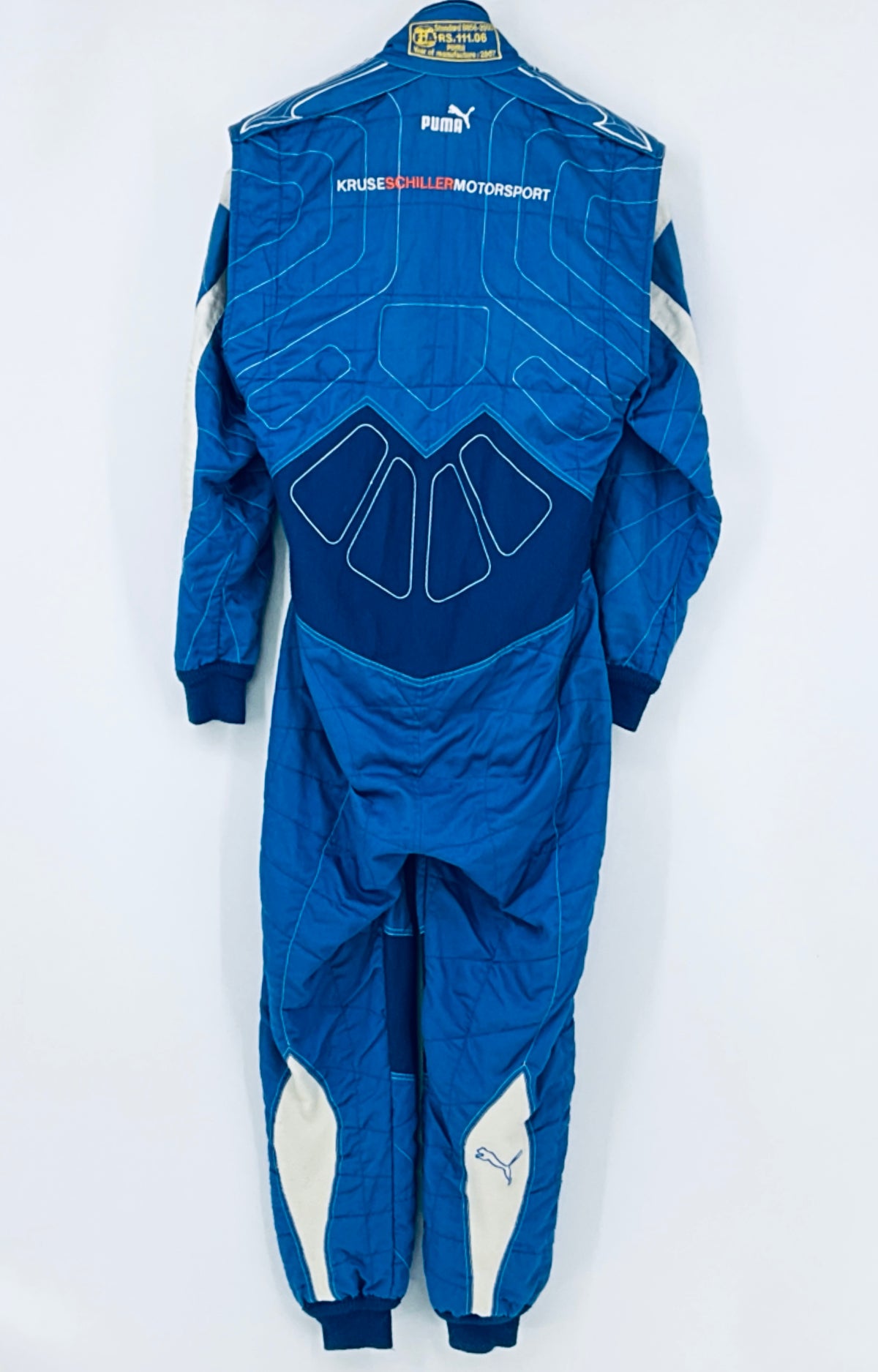 Blue race-worn driver suit back view with large graphic and Puma logo at top