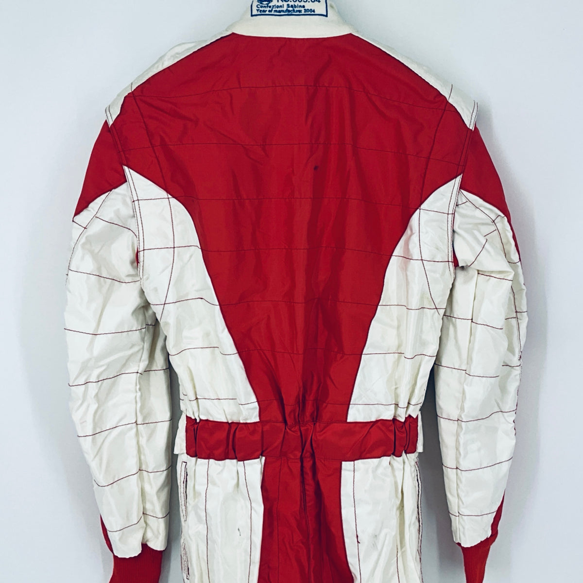 Red and white racing driver suit back with stitched grid lines and waistband