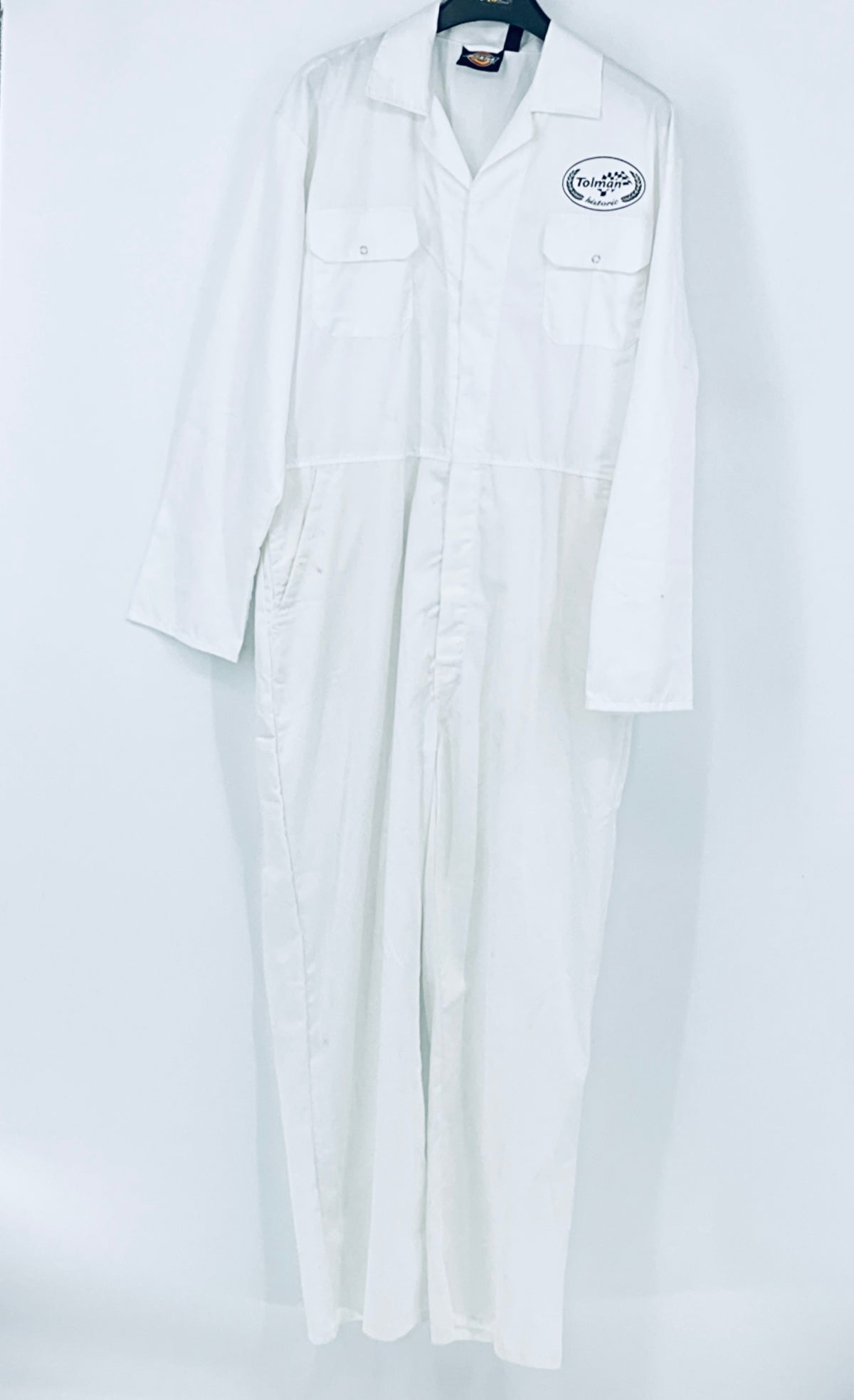 White racing overalls with chest logo patch and long straight legs