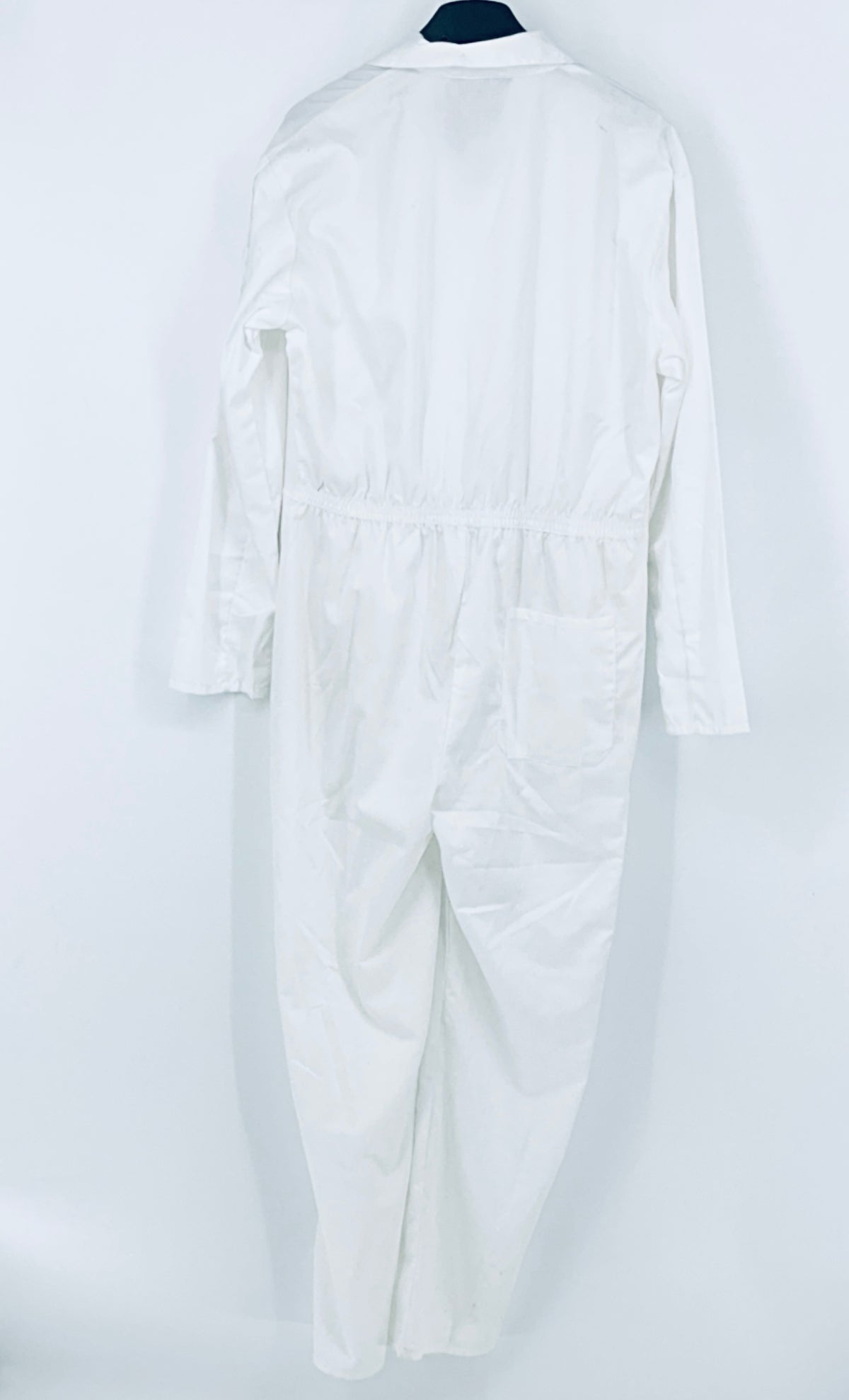 White overalls back view with elastic waist and long sleeves