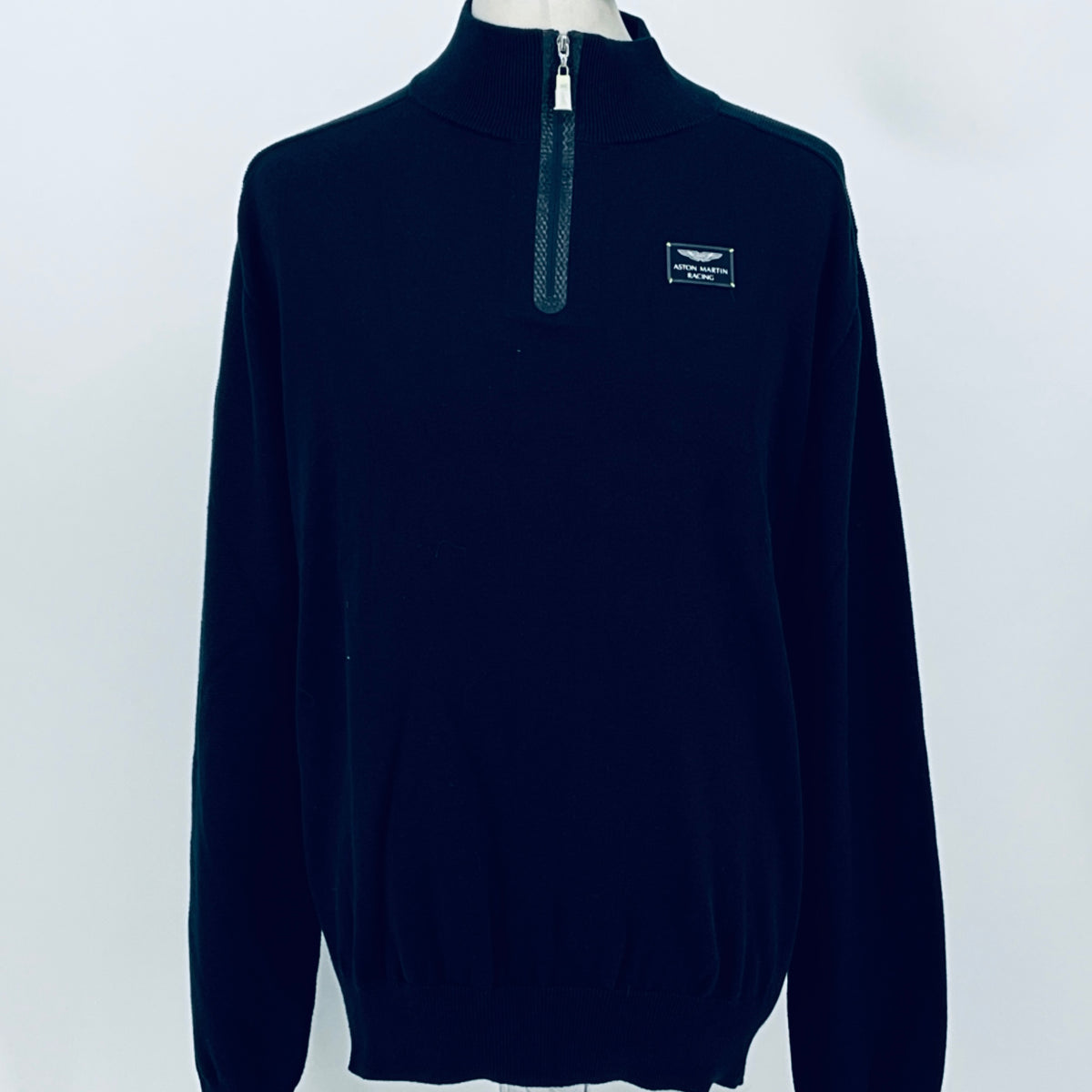 Navy quarter-zip jumper with zip neck and front crest patch