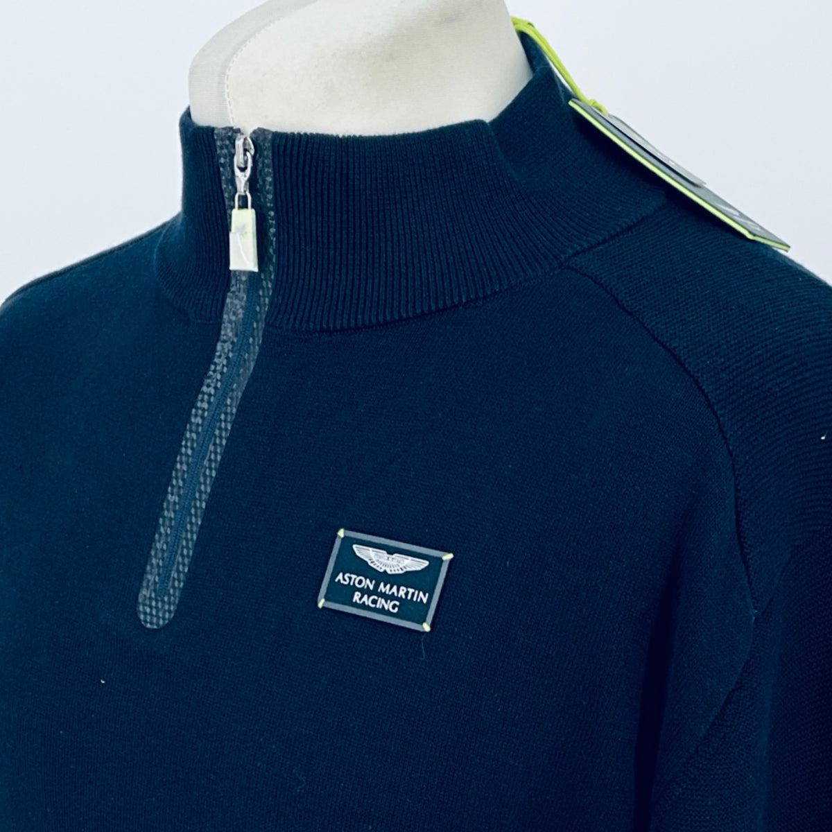 Navy quarter-zip sweater with silver zipper and small chest logo patch
