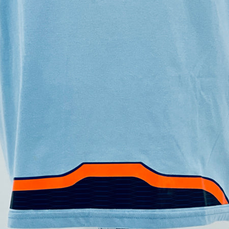 Light blue T-shirt hem with orange and dark blue racing stripe