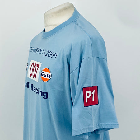 Light blue T-shirt sleeve and chest print with red 'P1' patch