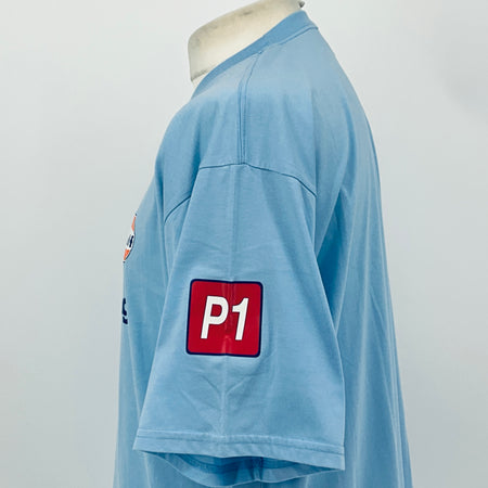 Light blue T-shirt side view with large red 'P1' patch