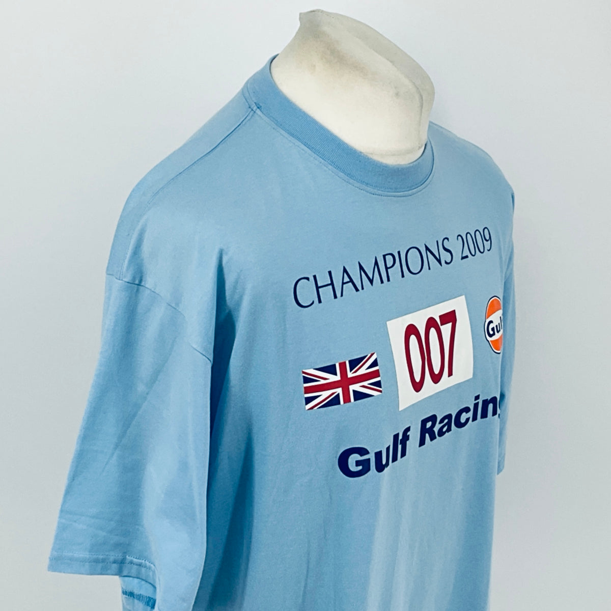 Light blue T-shirt with Champions 2009 text, 007 badge, and Gulf Racing logo