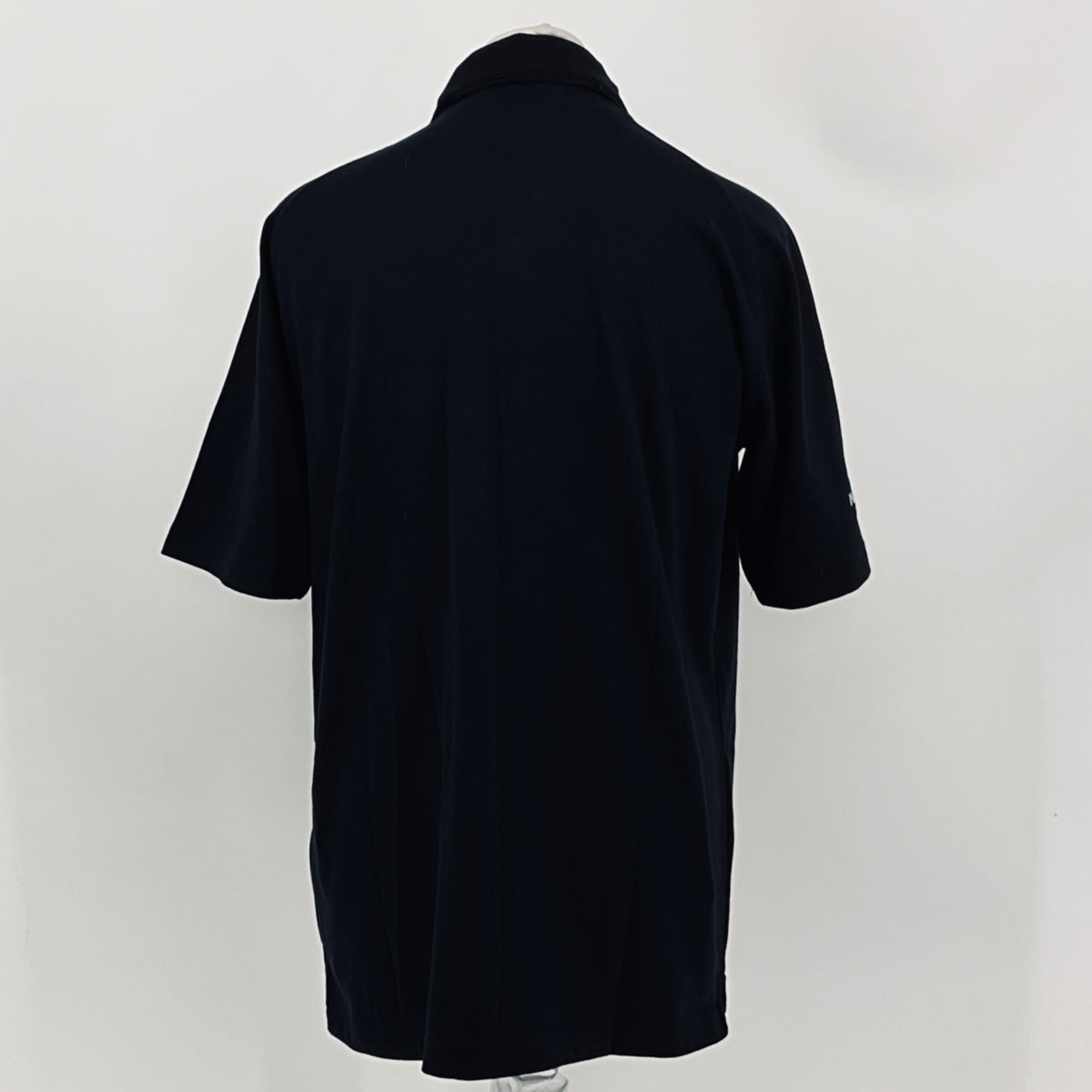 Black polo shirt back view with short sleeves and buttoned collar