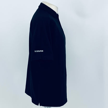 Black polo shirt sleeve with Nissan logo text