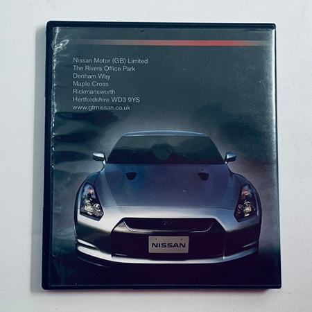 Nissan employee information disc case back with car image and address text