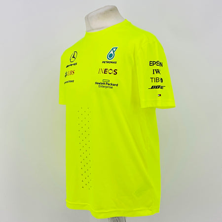 Neon yellow hi-vis T-shirt side view with sponsor logos on chest and right sleeve