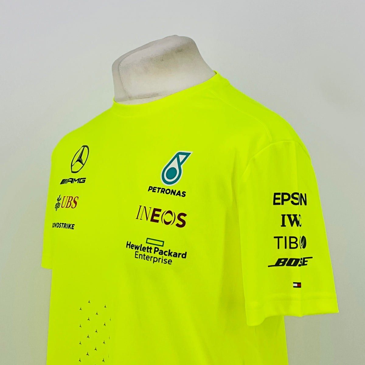 Neon yellow hi-vis T-shirt back view with PETRONAS and sponsor logos, including EPSN IWC TIBO