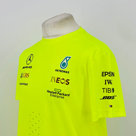 Neon yellow hi-vis T-shirt back view with PETRONAS and sponsor logos, including EPSN IWC TIBO