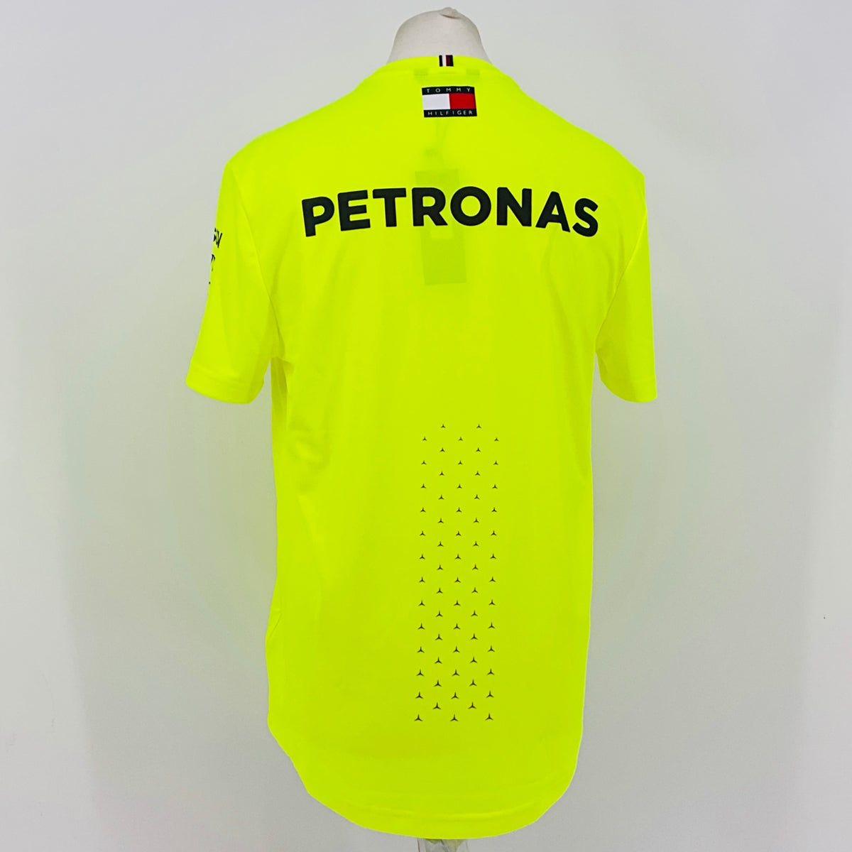 Neon yellow hi-vis T-shirt back view with large PETRONAS logo and dotted pattern