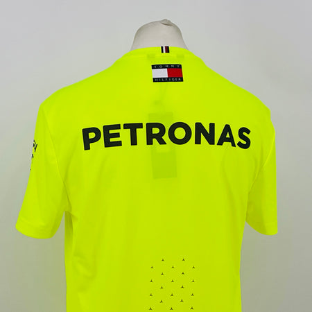 Neon yellow hi-vis T-shirt back close-up with large PETRONAS text and Tommy Hilfiger collar tag