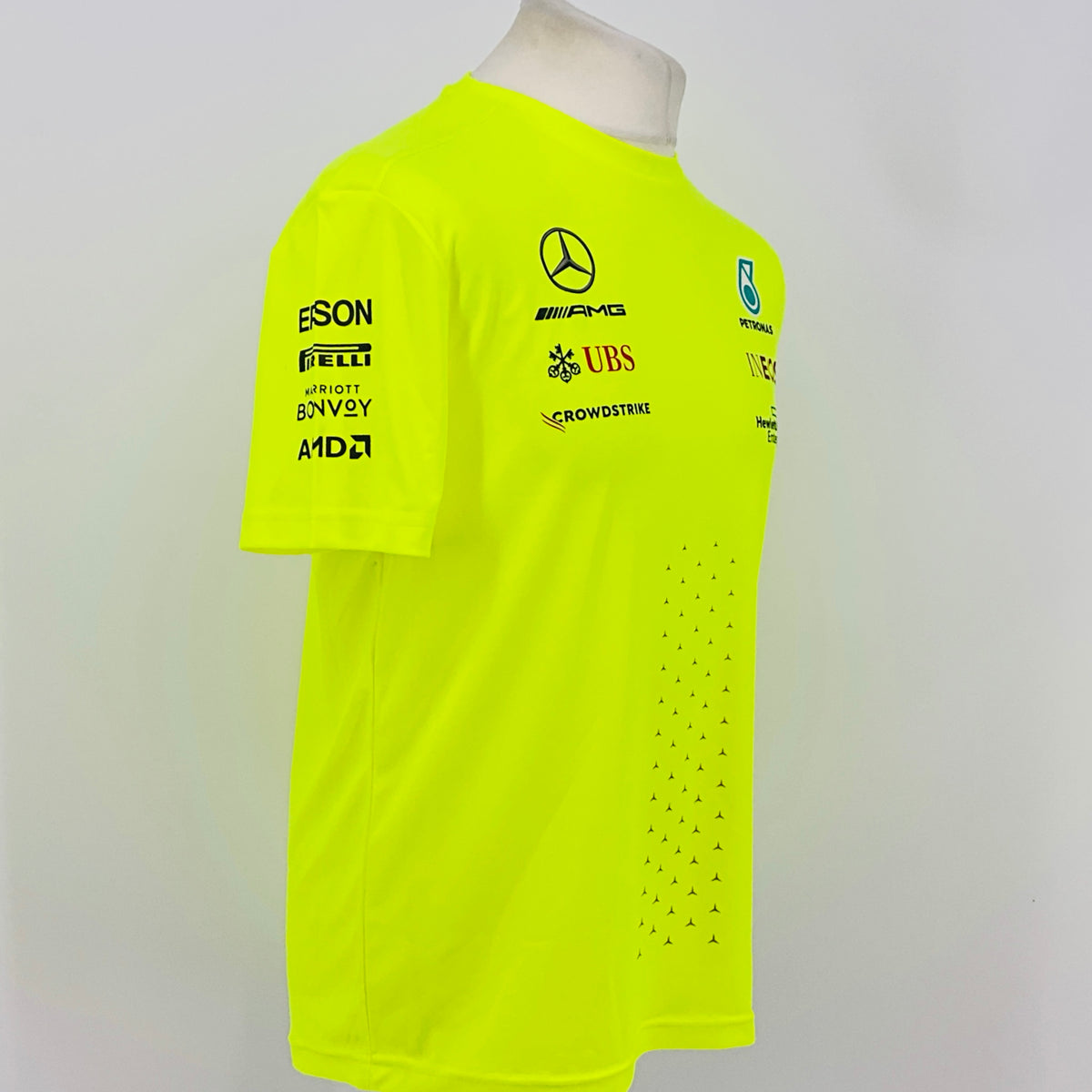 Neon yellow hi-vis T-shirt front side view with AMGs, UBS, and INEOS sponsor logos
