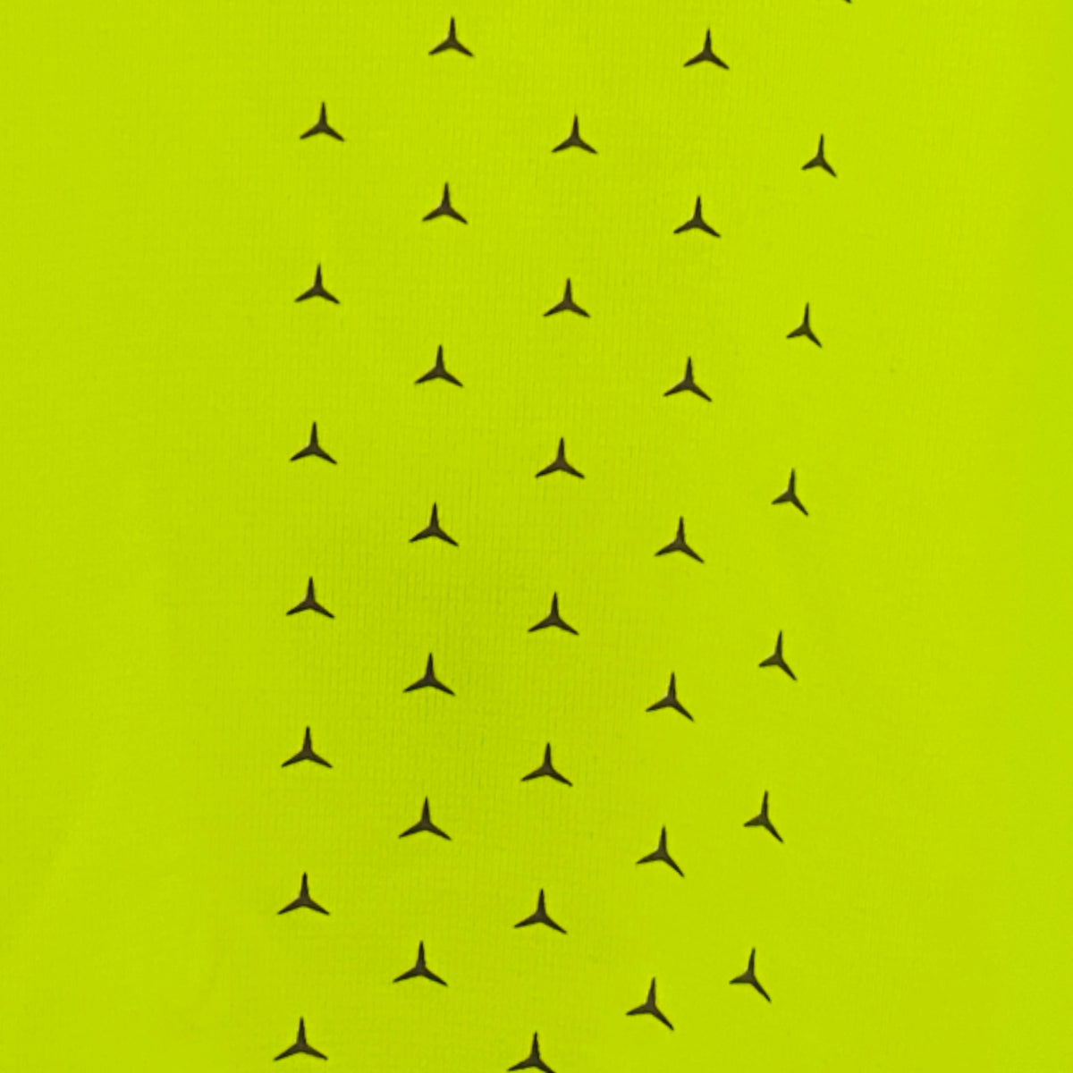 Hi-vis neon yellow T-shirt fabric with small black star print pattern