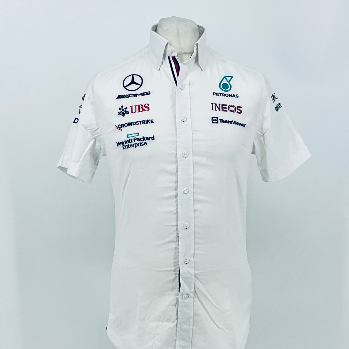 White button-front team shirt with Mercedes AMG, UBS, and Petronas Ineos logos