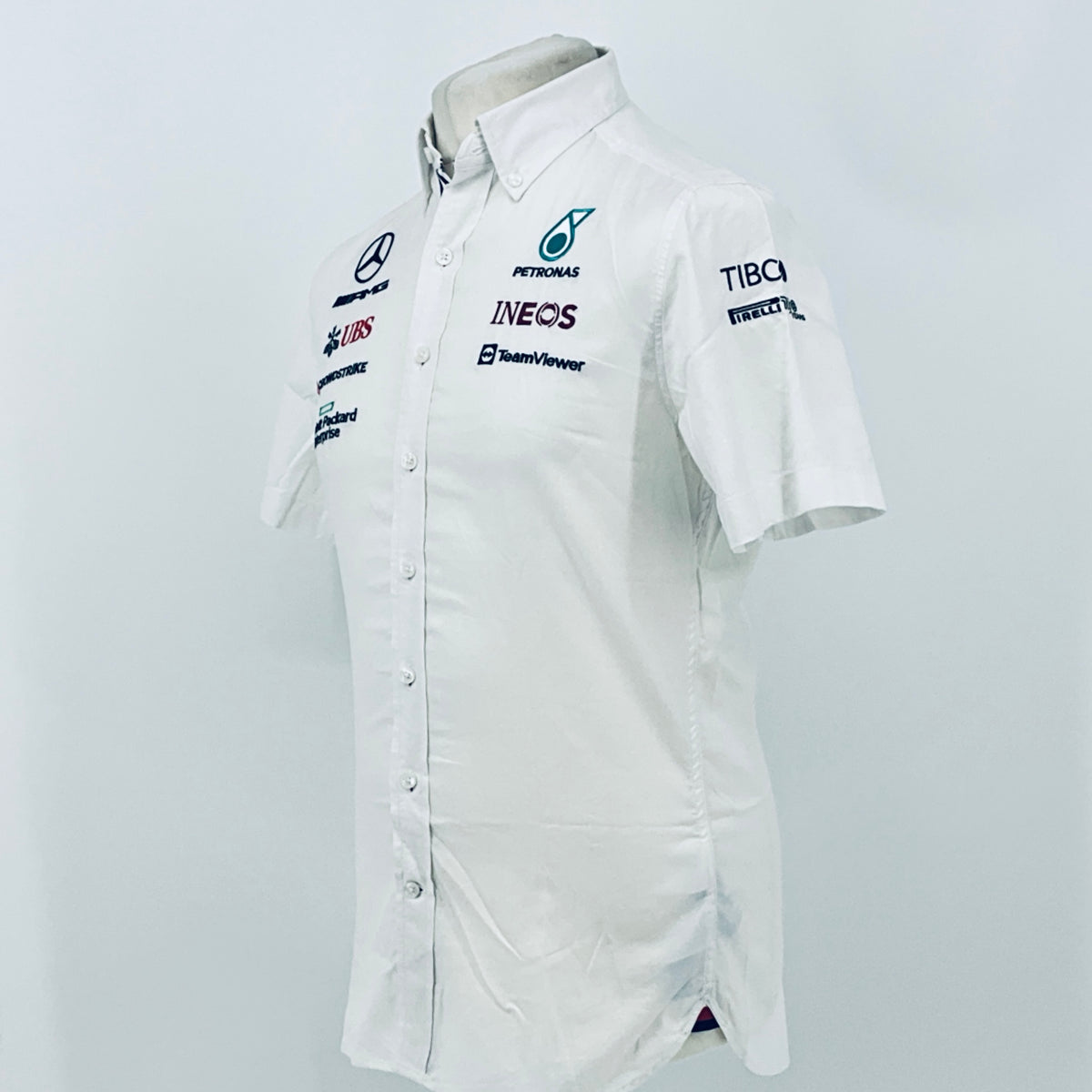 White team shirt with Petronas Ineos, TeamViewer, and Mercedes-AMG sleeve logos