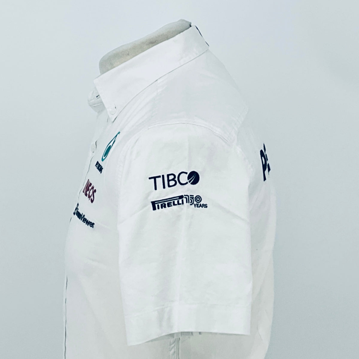 White team shirt back with TIBCO and Pirelli logos, short sleeves