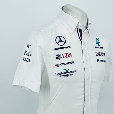 White button-front team shirt with Mercedes-AMG, UBS, CrowdStrike, and INEOS logos
