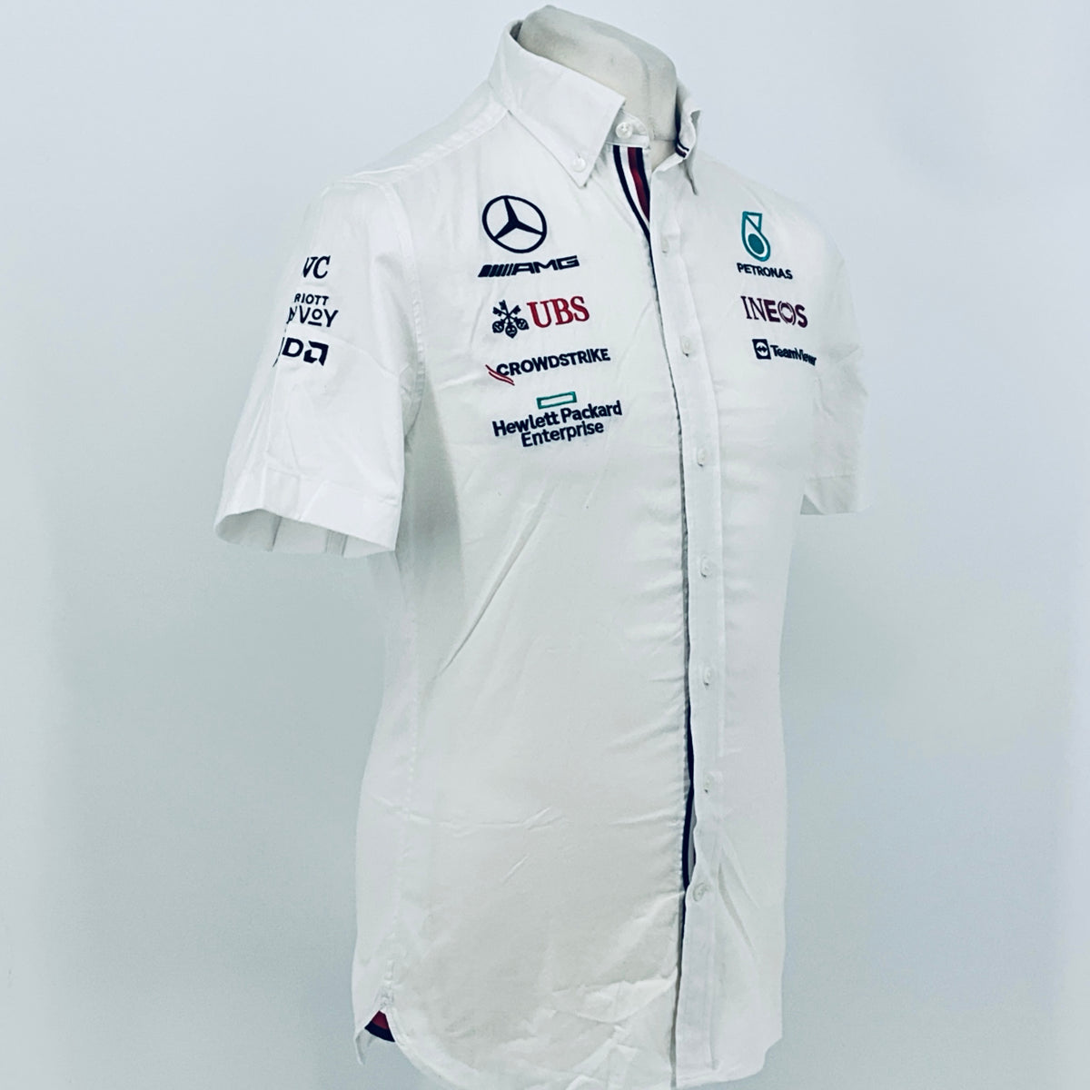 White team shirt front with Mercedes-AMG, UBS, and Petronas Ineos logos