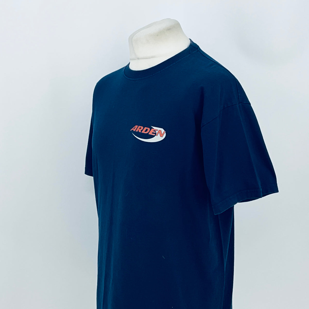 Blue crew-neck T-shirt with Arden logo, short sleeves, side view.